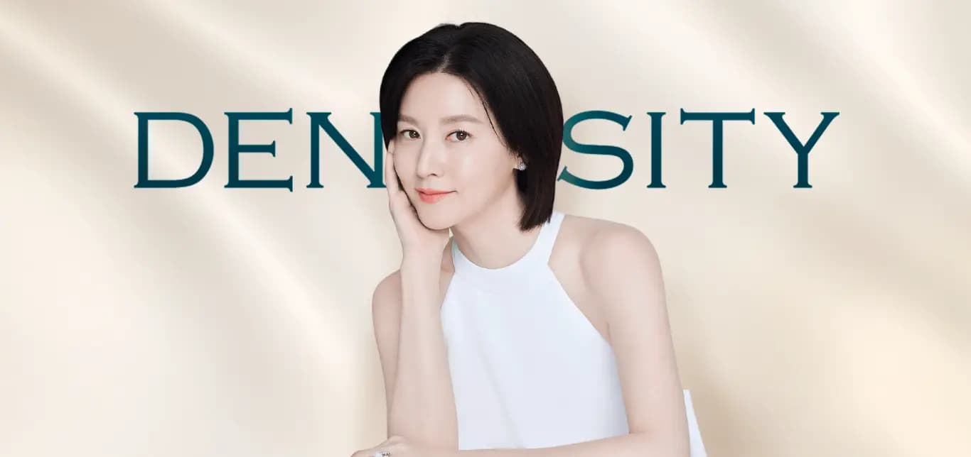 Density — the campaign image with its model in white against a cream satin ground